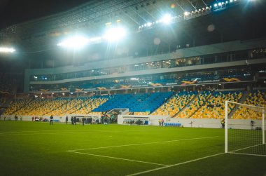 LVIV, UKRAINE - November 07, 2019: Night football stadium with light close up and general view during the UEFA Europa League match between Alexandria vs AS Saint Etienne (France), Ukraine