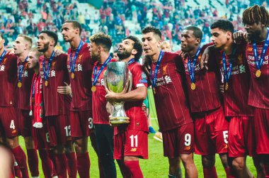 Istanbul, Turkey - August 14, 2019: Mohamed Salah celebrate victory with Liverpool  team and holdind trophy the UEFA Super Cup in Vodafone Arena, Turkey