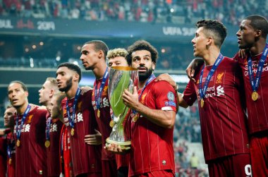 Istanbul, Turkey - August 14, 2019: Mohamed Salah celebrate victory with Liverpool  team and holdind trophy the UEFA Super Cup in Vodafone Arena, Turkey