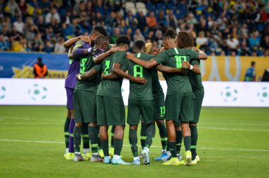DNIPRO, UKRAINE - September 10, 2019: Nigeria national team starting lineup cuddling during the friendly match between national team Ukraine against Nigeria national team, Ukraine