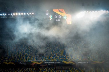 LVIV, UKRAINE - November 07, 2019: Stadium in the fog with a scoreboard during the UEFA Europa League match between Alexandria (Ukraine) vs AS Saint Etienne (France), Ukraine