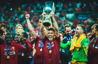 Istanbul, Turkey - August 14, 2019: Liverpool footballers celebrate victory at award ceremony during the UEFA Super Cup Finals match between Liverpool and Chelsea at Vodafone Park, Turkey