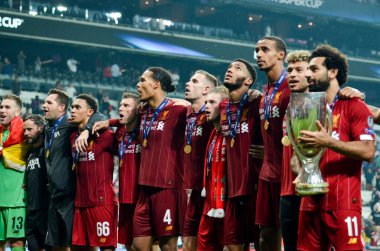 Istanbul, Turkey - August 14, 2019: Mohamed Salah celebrate victory with Liverpool  team and holdind trophy the UEFA Super Cup in Vodafone Arena, Turkey