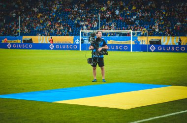 DNIPRO, UKRAINE - September 10, 2019: TV operartor and cameraman during the friendly match between national team Ukraine against Nigeria national team, Ukraine