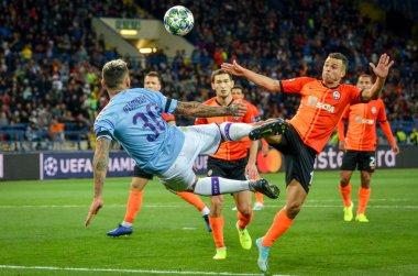 KHARKIV, UKRAINE - September 18, 2019: Nicolas Otamendi punches ball with scissors through herself during the UEFA Champions League match between Shakhtar vs Manchester City (England), Ukraine