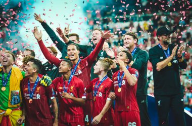 Istanbul, Turkey - August 14, 2019: Liverpool footballers celebrate victory at award ceremony during the UEFA Super Cup Finals match between Liverpool and Chelsea at Vodafone Park, Turkey