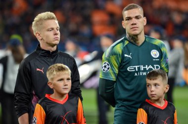 KHARKIV, UKRAINE - September 18, 2019: Oleksandr Zinchenko and Ederson during the UEFA Champions League match between Shakhtar Donetsk vs Manchester City (England), Ukraine