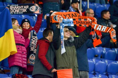KHARKIV, UKRAINE - December 11, 2019: Football support their team  during the UEFA Champions League match between Shakhtar vs Atalanta Bergamasca Calcio BC (Italy), Ukraine