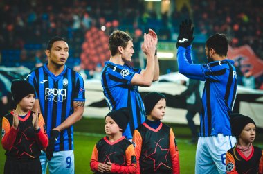 KHARKIV, UKRAINE - December 11, 2019: Atalanta BC player thanks fans for their support during the UEFA Champions League match between Shakhtar vs Atalanta BC (Italy), Ukraine