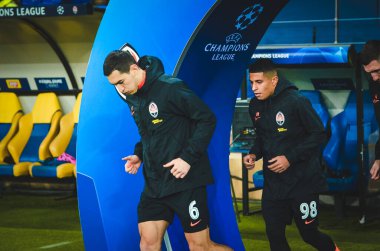 KHARKIV, UKRAINE - December 11, 2019: Shakhtar Football players enters on the pith during the UEFA Champions League match between Shakhtar vs Atalanta BC (Italy), Ukraine