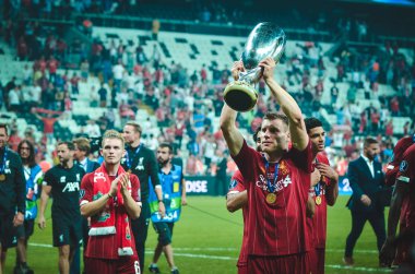 Istanbul, Turkey - August 14, 2019: James Milner holding trophy after the victory the UEFA Super Cup at Vodafone Park in Vodafone Arena, Turkey