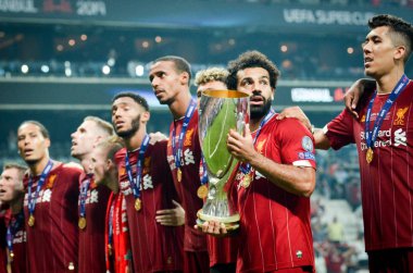 Istanbul, Turkey - August 14, 2019: Mohamed Salah celebrate victory with Liverpool  team and holdind trophy the UEFA Super Cup in Vodafone Arena, Turkey