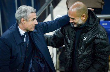 KHARKIV, UKRAINE - September 18, 2019: Pep Guardiola and Coach Luis Castro Hugging during the UEFA Champions League match between Shakhtar vs Manchester City, Ukraine