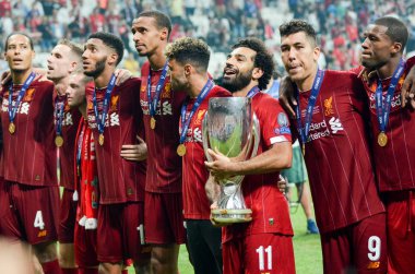 Istanbul, Turkey - August 14, 2019: Mohamed Salah celebrate victory with Liverpool  team and holdind trophy the UEFA Super Cup in Vodafone Arena, Turkey