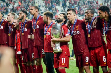 Istanbul, Turkey - August 14, 2019: Mohamed Salah celebrate victory with Liverpool  team and holdind trophy the UEFA Super Cup in Vodafone Arena, Turkey