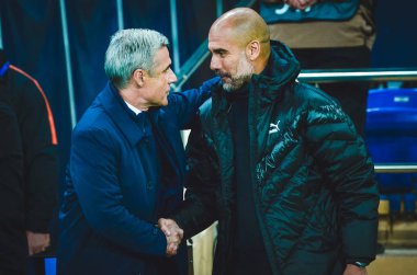 KHARKIV, UKRAINE - September 18, 2019: Pep Guardiola and Coach Luis Castro Hugging during the UEFA Champions League match between Shakhtar vs Manchester City, Ukraine