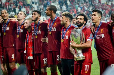 Istanbul, Turkey - August 14, 2019: Mohamed Salah celebrate victory with Liverpool  team and holdind trophy the UEFA Super Cup in Vodafone Arena, Turkey