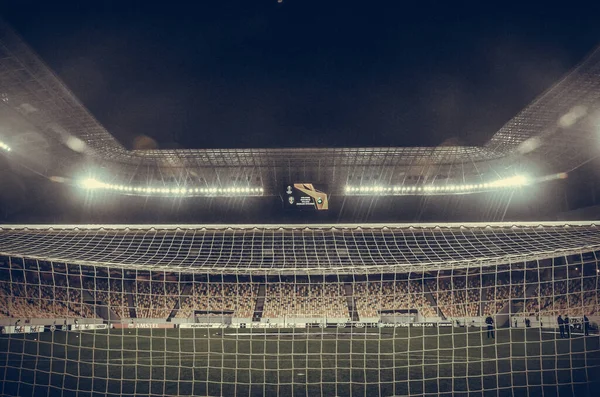 LVIV, UKRAINE - November 07, 2019: Night football stadium close up behind the gate during the UEFA Europa League match between Alexandria (Ukraine) vs AS Saint Etienne (France), Ukraine