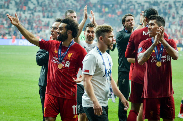 Istanbul, Turkey - August 14, 2019: Liverpool footballers celebrate victory at award ceremony during the UEFA Super Cup Finals match between Liverpool and Chelsea at Vodafone Park, Turkey