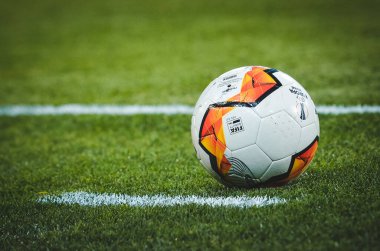 KHARKIV, UKRAINE - Febriary 20, 2020: Europa League ball lie  on the field close up with field white line during the UEFA Europe League match between Shakhtar vs SL Benfica, Ukraine