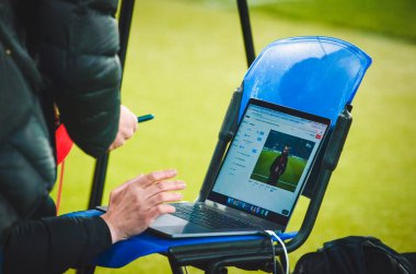 KHARKIV, UKRAINE - Febriary 20, 2020: Journalists working on a laptop during the UEFA Europe League match between Shakhtar Donetsk vs SL Benfica (Portugal), Ukraine