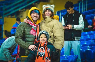 KHARKIV, UKRAINE - Febriary 20, 2020: Football fans on the stadium support theit team during the UEFA Europe League match between Shakhtar vs SL Benfica, Ukraine