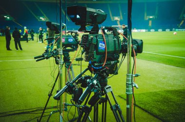 KHARKIV, UKRAINE - Febriary 20, 2020: Television cameras installed in the stadium are filming a report during the UEFA Europe League match between Shakhtar vs SL Benfica, Ukraine