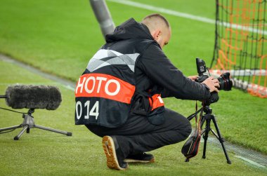 KHARKIV, UKRAINE - Febriary 20, 2020: Photographer mounts camera behind soccer goal during the UEFA Europe League match between Shakhtar Donetsk vs SL Benfica (Portugal), Ukraine