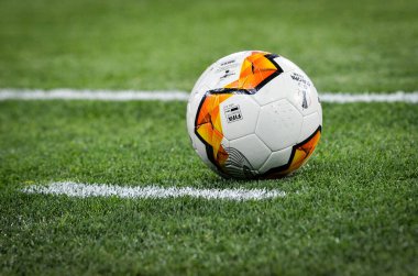 KHARKIV, UKRAINE - Febriary 20, 2020: Europa League ball lie  on the field close up with field white line during the UEFA Europe League match between Shakhtar vs SL Benfica, Ukraine