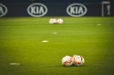 KHARKIV, UKRAINE - Febriary 20, 2020: Europa League ball lie  on the field close up with field white line during the UEFA Europe League match between Shakhtar vs SL Benfica, Ukraine