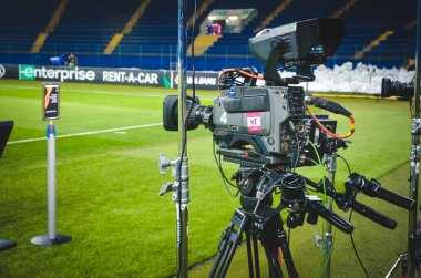 KHARKIV, UKRAINE - Febriary 20, 2020: Television cameras installed in the stadium are filming a report during the UEFA Europe League match between Shakhtar vs SL Benfica, Ukraine