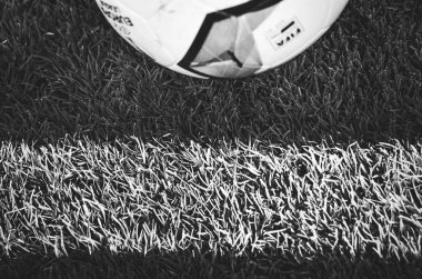 KHARKIV, UKRAINE - Febriary 20, 2020: Europa League ball lie  on the field close up with field white line during the UEFA Europe League match between Shakhtar vs SL Benfica, Ukraine