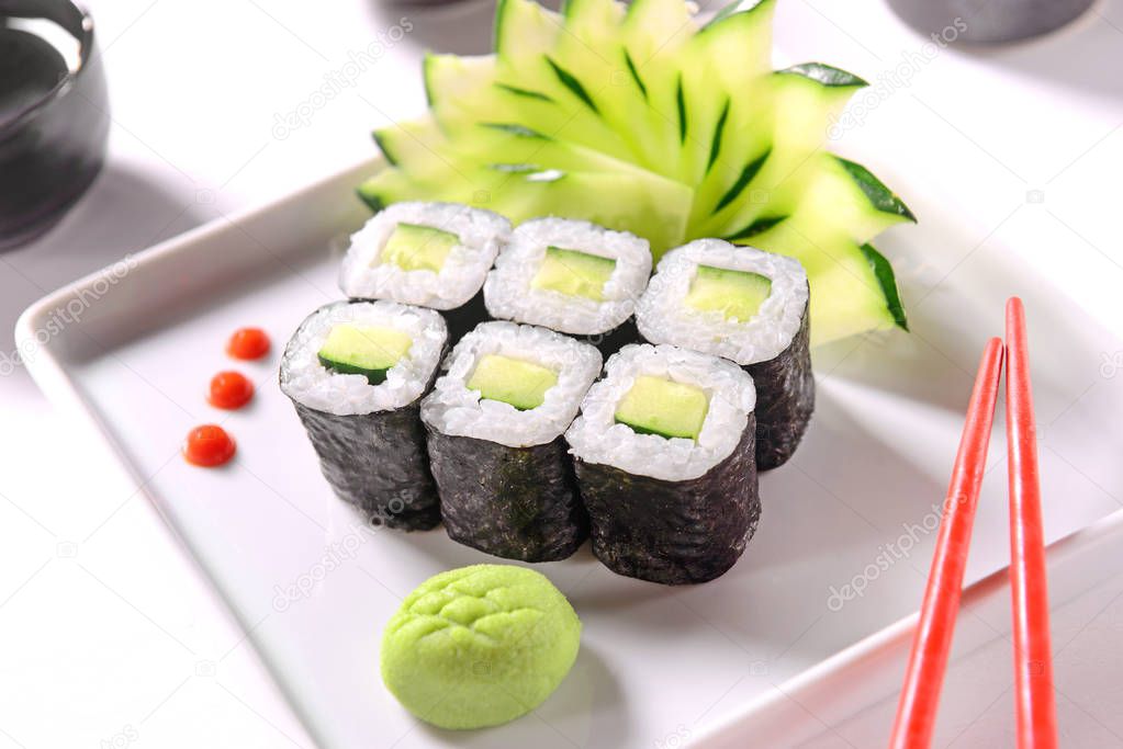 Hossomaki vegan sushi on white dish-were