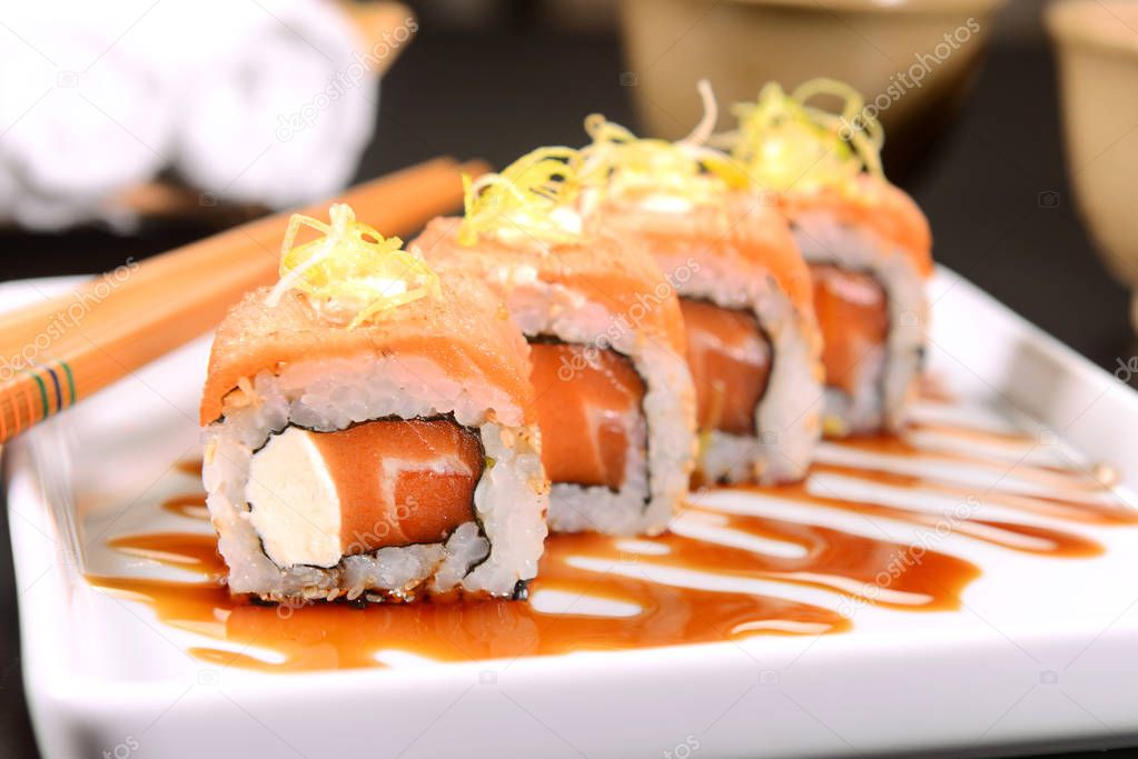 Salmon Sushi with leek straw on top