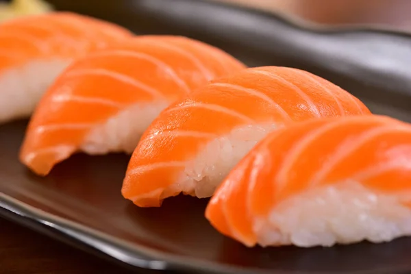 Salmon nigiri sushi on restaurant table