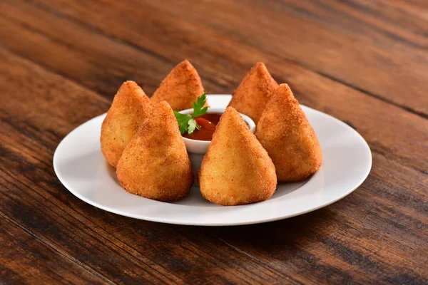 Deep fried Brazilian snack on bar table