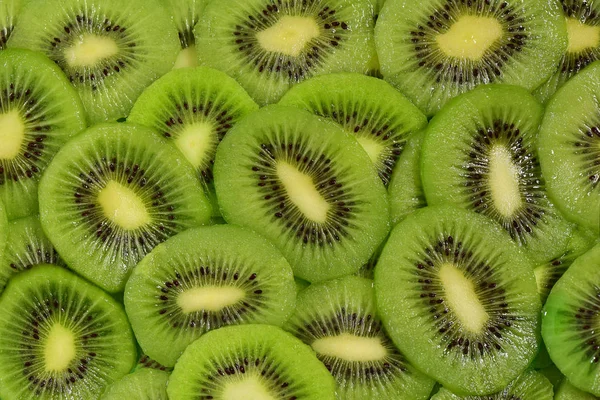 Rebanadas Fruta Kiwi Dispuestas Como Fondo — Foto de Stock