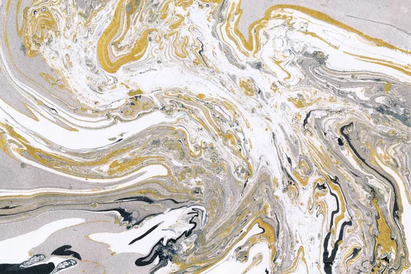 Gold, white and gray marble ink texture. Hand drawn pattern abstract background. Ink marble paper texture.