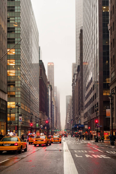 Taxis in rainy weather on Madison avenue on January 28, 2009 in Midtown Manhattan, New York City, USA