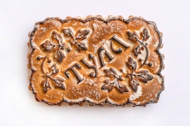 Famous Tula Pryanik, traditional ethnic Russian sweet baked bread made with honey, from the city of Tula (with the city name imprinted on pryanik), sold at the Christmas fairs clipart