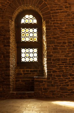 Window detail of interior hall with stone seat, medieval castle in Ghent, Belgium clipart