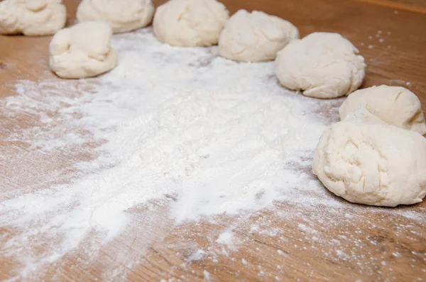 The child makes homemade pastry from the dough. Cooking from home dough.