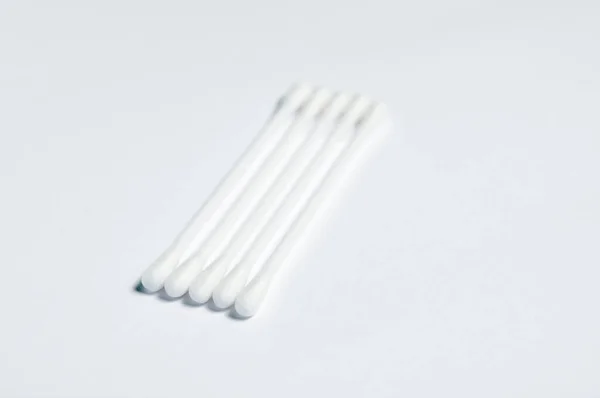 Cotton buds on white background. Cotton Buds For Personal Care