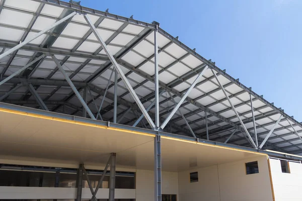 Metal frame of the building with a sandwich panel of insulation on the wall. The use of modern building materials