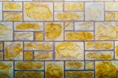 Kahverengi taş duvar. Döşeme. Yapısal soyut arkaplan. Ön görünüm.