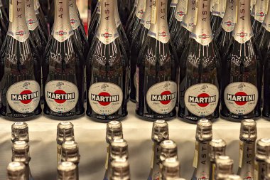 Rows of bottles of Asti Martini bottles in store. clipart
