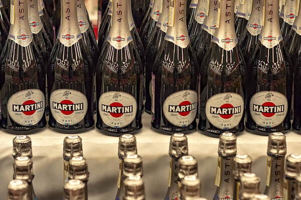 Rows of bottles of Asti Martini bottles in store.