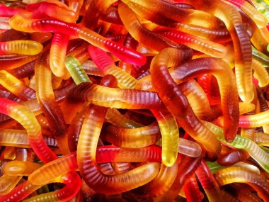 Multi-colored chewing candies in bulk. Top view.