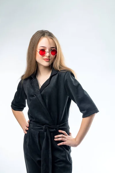 Beautiful young girl in sunglasses with mirror glasses in the studio — Stock Photo, Image