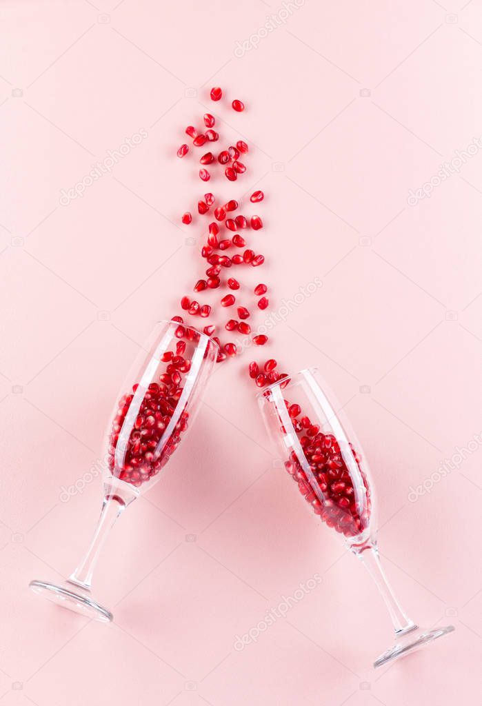 glass goblets. Pomegranate seeds. Spilled. Concept idea